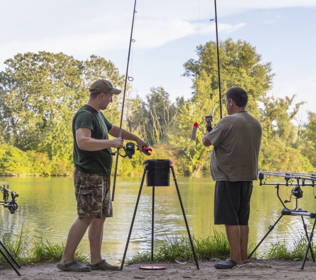 what is a spod rod - two men holding spod rods