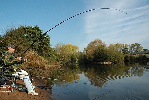 Man fishing with a feeder rod