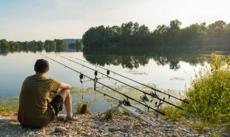 Carp Fishing Tips - Man Carp Fishing on sunny day