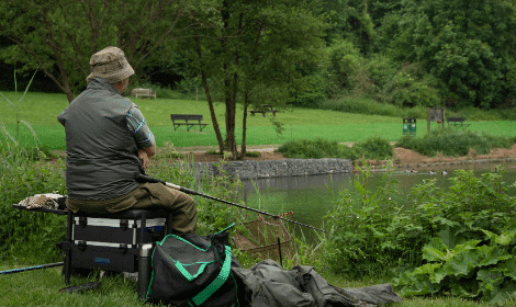 What is coarse fishing - angler on seatbox fishing for coarse fish (1)