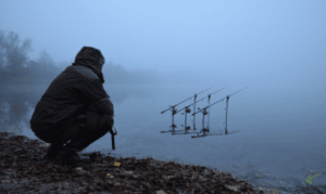 Is December A Good Month For Carp Fishing - Carp fisherman by foggy bank